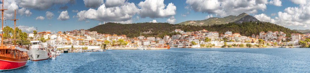 Poster - Wide panorama of a resort town Neos Marmaras in Halkidiki, Sithonia. Travel destinations and real estate in Greece