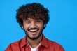 © insta_photos - Smiling cheerful young curly bearded indian cool positive guy laughing isolated on blue background. Happy ethnic man looking at camera having fun posing for headshot close up face portrait.