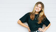 © annanahabed - Outdoor portrait of pretty young teenage gir with brown hair posing on white background, wearing black t-shirt