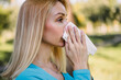 © Sanja - Pretty blonde blowing her nose.