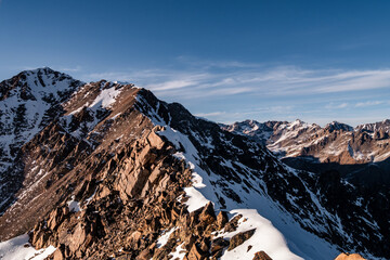 Wall Mural - Snowy Greater Caucasus ridge. Sunny day. Before suset. View from 3500m