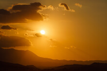 Sun Goes Down Behind Mountains -Sunset In Hilly Terrain