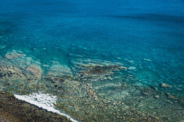 Wall Mural - sea surface with small waves, top view in blue and turquoise color tones