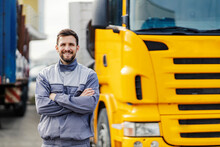 An Import And Export Firm Driver Posing With Trucks And Smiling At The Camera.