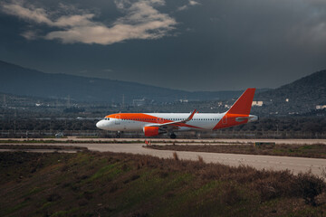 Wall Mural - Airplane taxiing to the terminal after landing