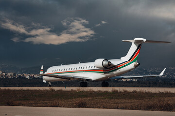 Wall Mural - Airplane taxiing to the terminal after landing