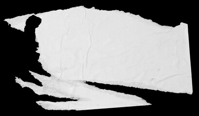 White paper torn piece isolated on black background. Dirty wrinkled glued paper poster texture