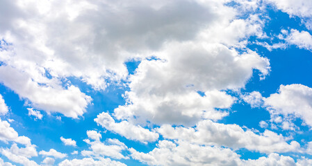 Wall Mural - panorama or panoramic photo of blue sky and white clouds or cloudscape.