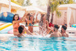 © alphaspirit - Group of friends in swimsuit enjoy in a swimming pool