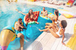 © alphaspirit - Group of friends in swimsuit enjoy in a swimming pool