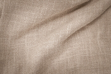 Jute hessian sackcloth woven burlap texture pattern background in old aged yellow beige cream gold brown color