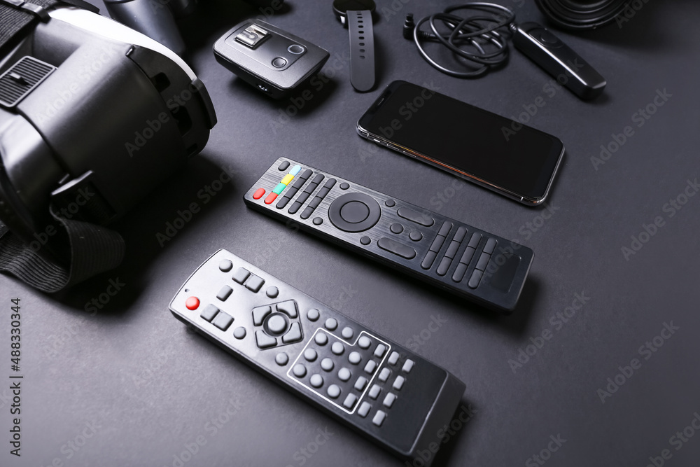 Set of modern gadgets on dark background, closeup