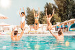 © alphaspirit - Group of friends in swimsuit enjoy in a swimming pool