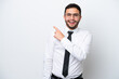 © luismolinero - Business Brazilian man isolated on white background surprised and pointing side