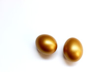 The Golden Eggs Isolated On The White Background