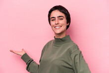 Young Caucasian Woman Isolated On Pink Background Showing A Welcome Expression.