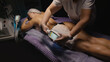 Woman getting cryolipolysis anti-fat anti-cellulite freezing treatment procedure in spa salon. Hardware cosmetology. Wellness body and skin care, beauty treatment, receiving rejuvenation procedure