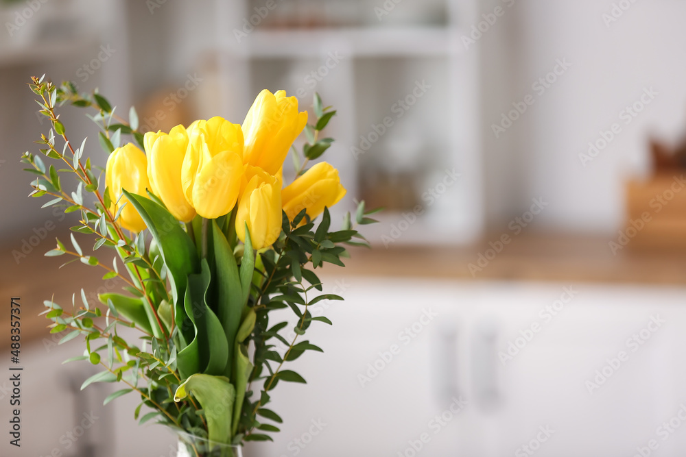 Bouquet of beautiful flowers in kitchen, closeup