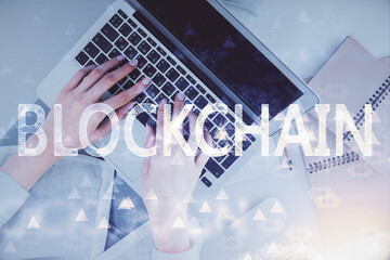 Poster - Double exposure of woman hands working on computer and blockchain theme hologram drawing. Top View. bitcoin cryptocurrency concept.