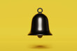3d render of a black shiny bell on a yellow background