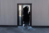 Fototapeta Tęcza - Broken glass door in shopping mall. Vandalism, burglary concept. Insurance concept.