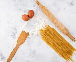 raw pasta with flour