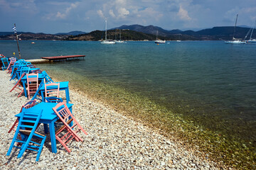 Wall Mural - Chairs and tables tavern by the sea on the island of Lefkada