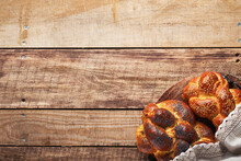 Shabbat Shalom. Bread Challah With Sesame Seeds And Poppy Seeds On Wooden Background. Traditional Jewish Bread For Shabbat And Holidays. Rustic Concept. Copy Space. Selective Focus.