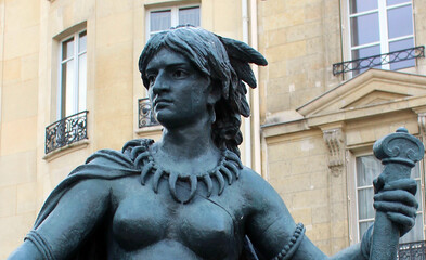 Wall Mural - Paris. France. 16 October 2020. Bronze green sculpture woman near the parisian museum.