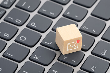 Fototapete - New email graphic on wooden block over laptop keyboard