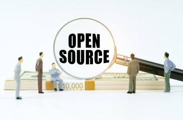 Aufkleber - On a white surface, a dollar, figurines of people and a magnifying glass with the inscription - Open Source