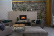 modern studio interior with decorative stone walls in grey. stone wood, tiles and led lighting in the design of the room