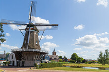 Dutch Windmill In The Fishing Village Of Bunschoten In The Netherlands.