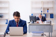 © Elnur - Two male colleagues working in the office