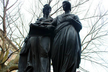 Wall Mural - Vienna. Austria.  Sculpture of a man and woman in the Resselpark Park.