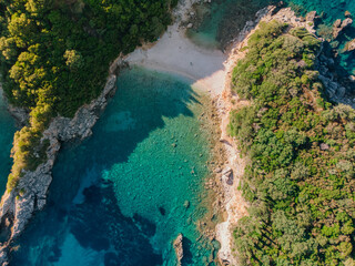 Wall Mural - Aerial view of Corfu island. Blue lagoon is flooded with sunlight.