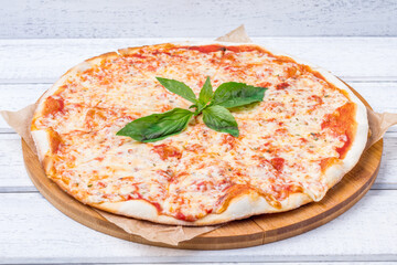 Wall Mural - Italian pizza Margherita on white wooden table