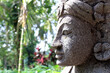 Closeup of Balinese style statues and offering in Ubud.