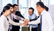 © Art_Photo - Successful of group professional business people to win of celebrating project success.Creative business putting and joining their hands good teamwork together at office