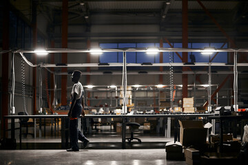 Wall Mural - african factory worker delivering box at the storage