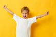© Tatiana - Photo portrait curly little boy in a white T-shirt with glasses gesturing with his hands isolated background unaltered