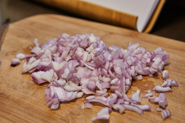 Poster - Sliced purple onion on a wooden board. Prepare ingredients and vegetables before cooking