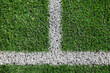 © Lazy_Bear - Part of football or soccer field close up, Artifical green grass with white border lines, Astroturf at stadium for spart games