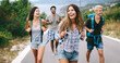 © NDABCREATIVITY - Group of happy friend traveler walking and having fun. Travel lifestyle and vacation concept