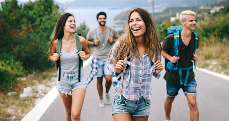 Wall Mural - group of happy friend traveler walking and having fun. travel lifestyle and vacation concept