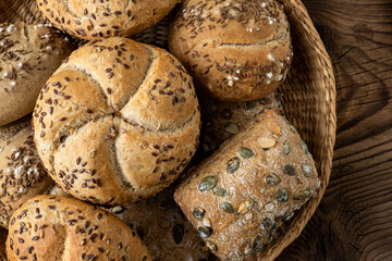 Wall Mural - Wicker basket with selection of breads and pastries. Assortment of baked products