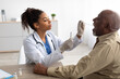 © Prostock-studio - Doctor taking PCR test sample from potentially infected mature man