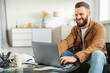 © Prostock-studio - Male Freelancer Using Laptop Computer Working Online Sitting At Home