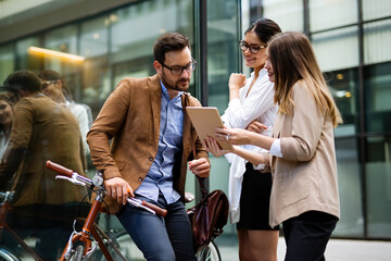 Poster - Business people and corporate concept. Portrait of group of business people talking in the city