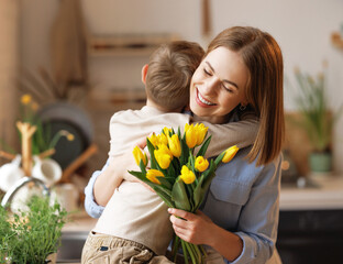 Wall Mural - grateful mother with bouquet hugging son